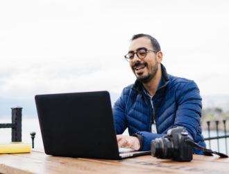 man on laptop outside